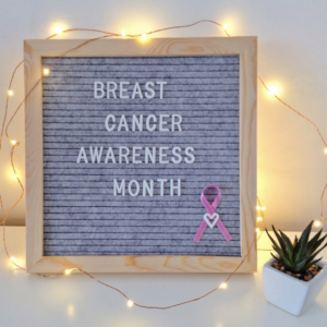 Breast Cancer Awareness Month Sign with Twinkle Lights Around it