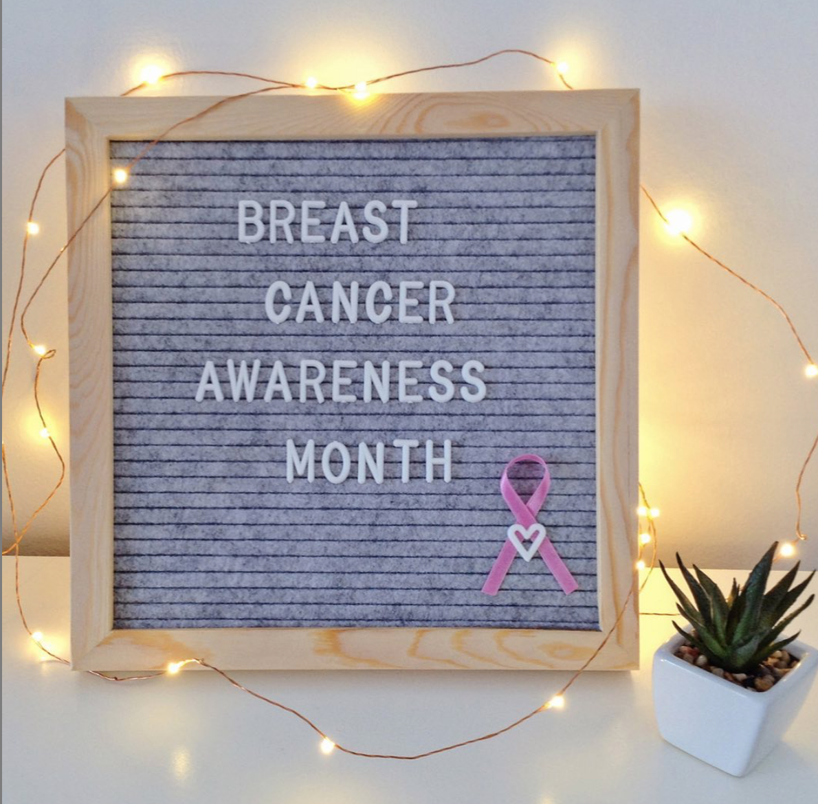 Breast Cancer Awareness Month Sign with Twinkle Lights Around it