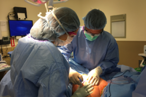 Anne Interviewed and Highlighted in the California Society of Plastic Surgeons - In this photo she is performing a surgery