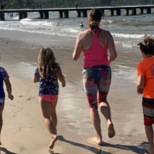 Anne Peled, M.D. Running on the beach with children - Exercising After Breast Cancer Surgery
