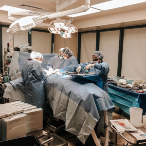 Dr. Anne Peled MD Performing ONCOPLASTIC BREAST SURGERY in San Francisco Team is working in the OR on a patient