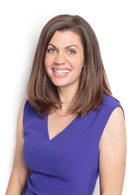 Headshot of Anne Peled, MD in purple top smiling