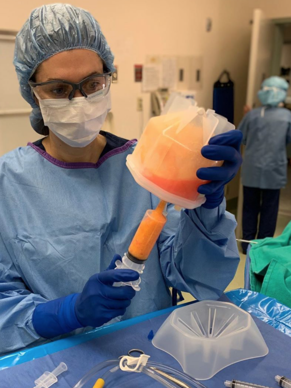 Anne Peled, M.D. in the OR holding Fat Grafting Process