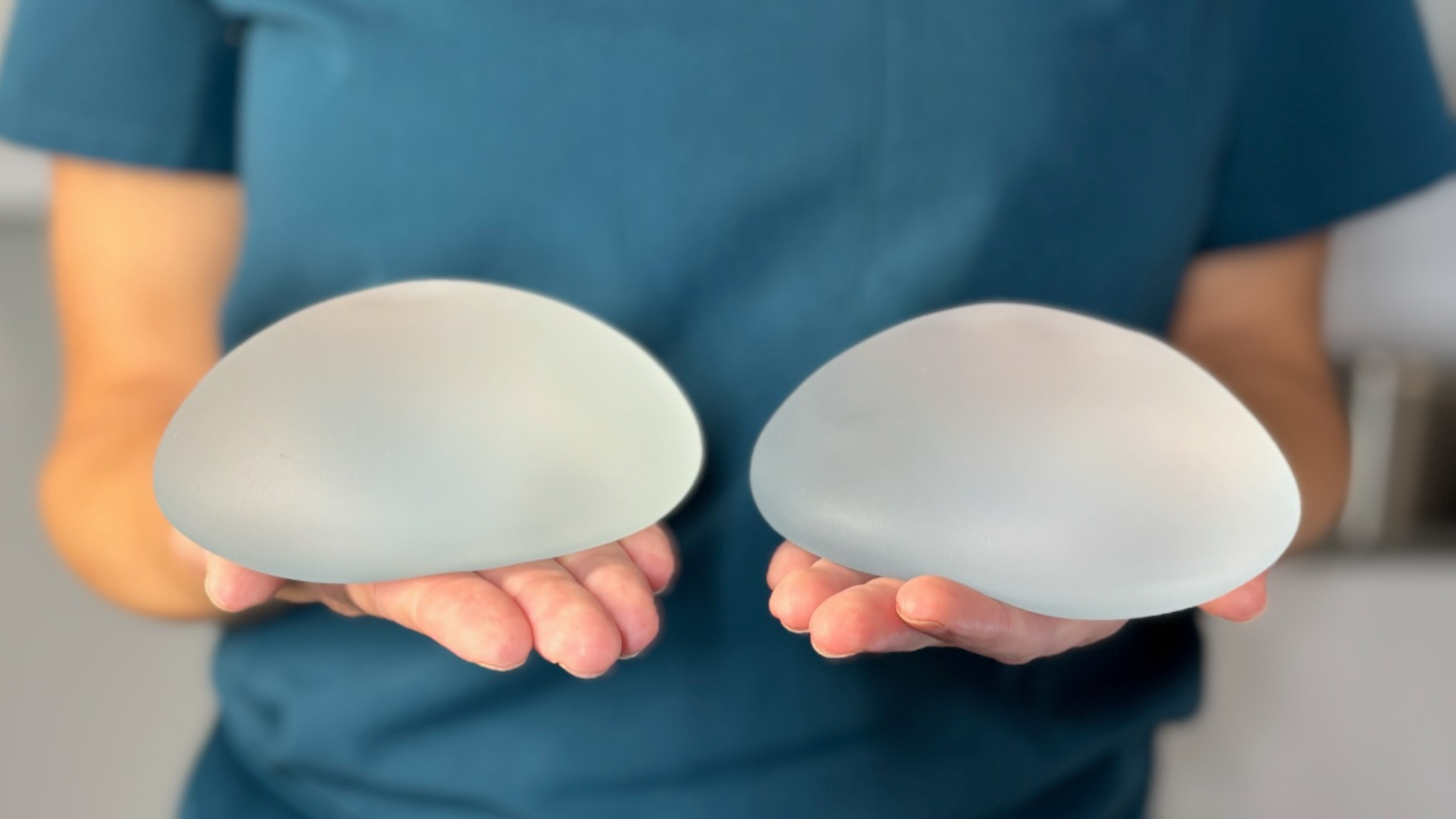 Doctor Holding Implants